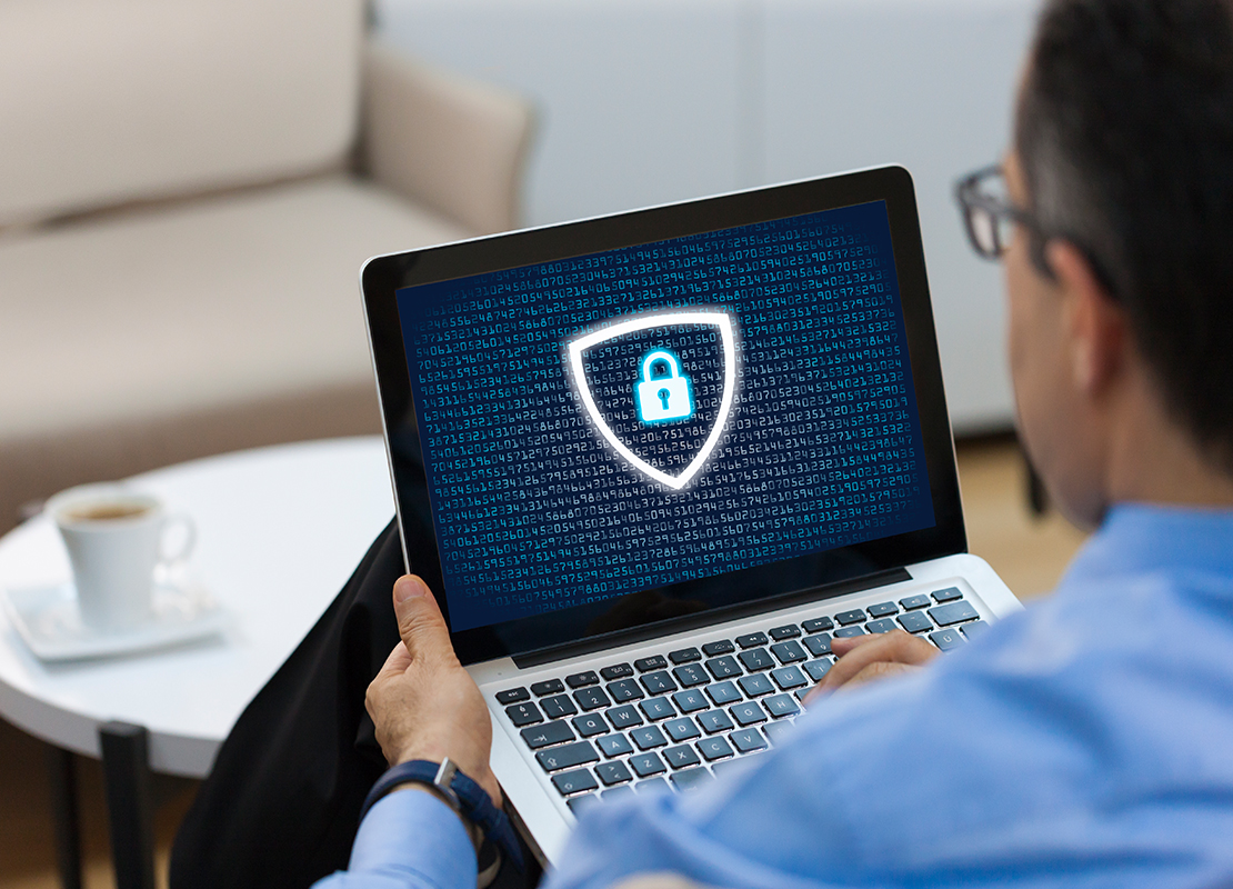 Professional holding laptop with lock on screen
