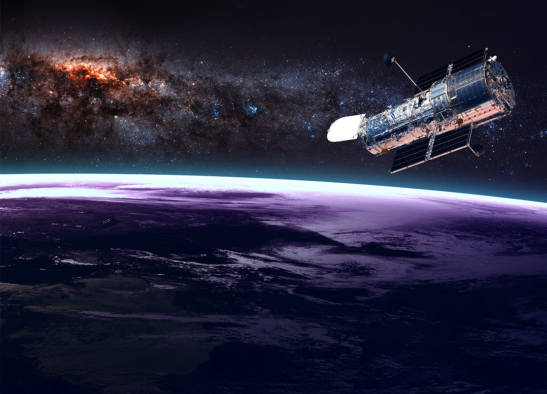The Hubble Space Telescope in orbit above the Earth.